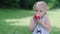 Healthy Nutrition. Child Eating Juicy Apple Outdoors