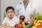 Healthy and nutrition concept. Kid learning about nutrition with doctor to choose eating fresh fruits and vegetables. Young asian