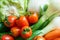 Healthy nutrition with fresh raw vegetables: a low angle close up view of a group of salad ingredients, lettuce, tomatoes,