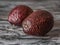 Healthy and nutritious fruits of brown avocado on dark background