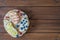 Healthy open sandwiches with fruits ,peach grapes blueberries and soft cheese on wooden background , top view , flat lay