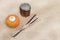 A healthy and organic pumpkin, a wooden box and some wooden sticks on rustic background