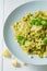 Healthy pasta with green pesto, basil and parmesan