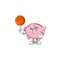 A Healthy piggy bank cartoon character playing basketball