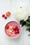 Healthy Pink Smoothie in the Bowl from Banana and Strawberries w