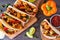 Healthy plant-based cauliflower fajitas, above view table scene over wood