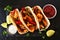 Healthy plant-based cauliflower fajitas, top view serving scene over a dark background