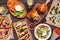 Healthy plant based fast food table scene. Overhead view on a wood background.