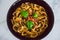 Healthy plant-based food, shell pasta with dairy-free mushroom sauce capsicum and basil