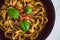 healthy plant-based food, shell pasta with dairy-free mushroom sauce capsicum and basil