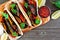 Healthy, plant-based meatless portobello mushroom steak fajitas, close up top view on a wood background