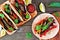 Healthy, plant-based meatless portobello mushroom steak fajitas, top view table scene on a wood background