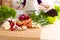 Healthy positive happy woman holding a paper shopping bag full of fruit and vegetables