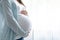 healthy pregnancy. Side view pregnant woman with big belly advanced pregnancy in hands. Banner copyspace for text