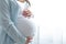 healthy pregnancy. Side view pregnant woman with big belly advanced pregnancy in hands. Banner copyspace for text