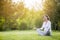 Healthy pregnant woman on meditation session on nature location