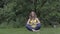 Healthy pregnant woman relax doing yoga in nature outdoors