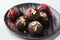 Healthy raw energy balls with cocoa, dates, maca, chia on white background