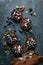 Healthy raw vegan dessert dates tartlets with chocolate cream of cashew, decorated with almond, pecan nuts and fresh blueberry
