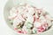 Healthy Red Radish and Green Scallion Onions Salad with Greek Yogurt Dressing in White Serving Bowl on Wood Kitchen Table