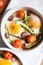 Healthy and rich breakfast with baked eggs and vegetables