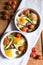 Healthy and rich breakfast with baked eggs and vegetables