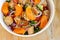 Healthy salad bowl with cuscus, chicken, tangerine and sesame seeds