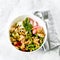 Healthy Salad Bowl. Mozzarella, vegetables, green leaves, green olives, whole grain bread, peanuts