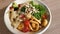 Healthy salad bowl on wooden table close up view