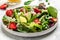 Healthy salad of fresh green asparagus, strawberry, rocket and cottage cheese salad. Diet menu. Food recipe background. Close up