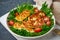 Healthy salad with fried halloumi and tomatoes, closeup, keto ketogenic diet