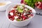 Healthy salad with pomegranate seeds, almond, feta cheese and black rice