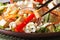 Healthy salad tofu and vegetables with chopsticks macro