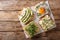 Healthy sandwiches with hummus, avocado, feta cheese, microgreen and egg closeup. horizontal top view