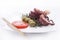 Healthy sea food detail - octopus, tomato, olives and rosemary