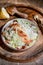 Healthy Shrimp Caesar salad bowl with parmesan cheese and lemon