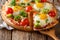 Healthy sliced pizza with eggs, broccoli, tomatoes and parsley c