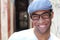 Healthy Smile. Teeth Whitening. Beautiful Smiling Young man Portrait close up. Over modern corridor background . Laughing