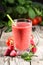 Healthy smoothie in a glass with strawberries