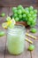 Healthy smoothie with green grape, lemon and honey