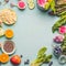 Healthy smoothie ingredients on light table, top view. Various fruits , vegetables and berries with almond, chia seeds and pine