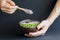 Healthy smoothie , plate made from coconut shell on dark background