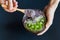 Healthy smoothie , plate made from coconut shell on dark background