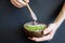 Healthy smoothie , plate made from coconut shell on dark background