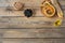 Healthy snack from crisp bread with hummus, olive oil, black olives and paprika on wooden background.