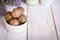 Healthy snack. Energy ball with date plam, black and white sesame, chia and rasin in ceramic bowl on wooden table. Vegan