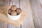 Healthy snack. Energy ball with date plam, black and white sesame, chia and rasin in ceramic bowl on wooden table. Vegan