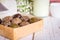 Healthy snack. Energy ball with date plam, black and white sesame, chia and rasin in paper box on wooden table. Vegan vegetarian