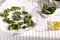 Healthy snack kale chips with salt and seasoning on a baking paper