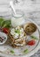 Healthy snack - rye crackers, cottage cheese with cucumber and flax seed